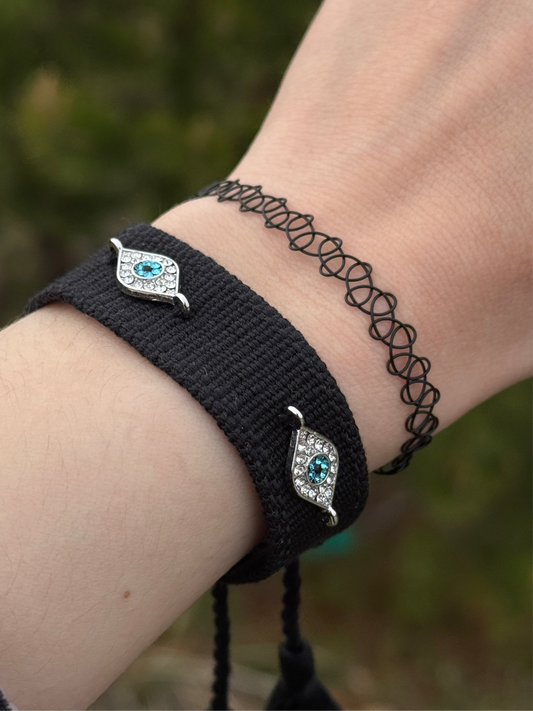 Black Evil eye embroidered bracelet on hand