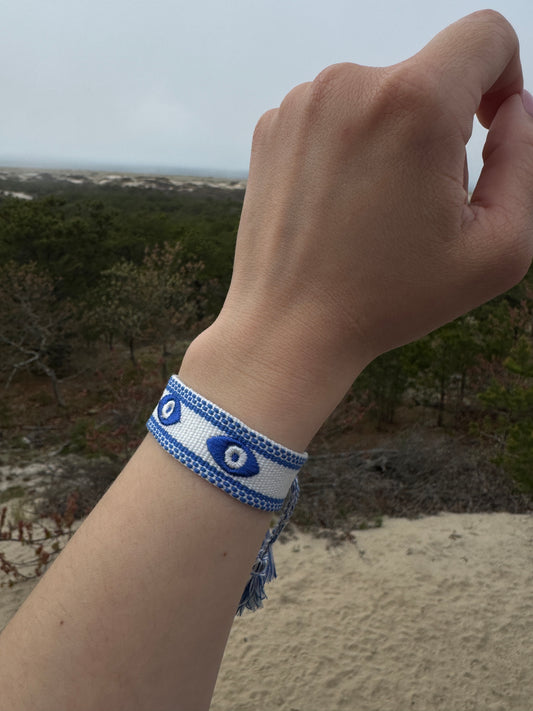 Evil eye blue and white embroidery bracelet on hand