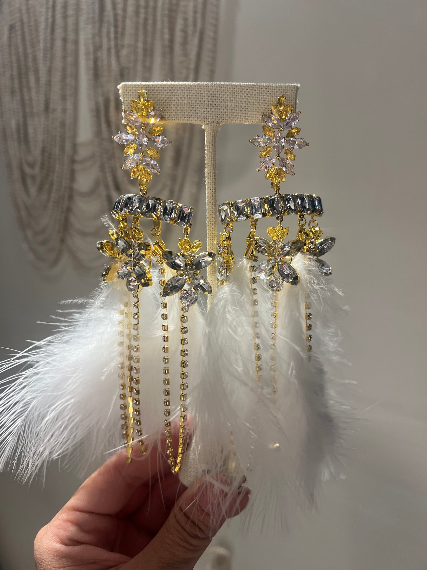 Feather statement earrings