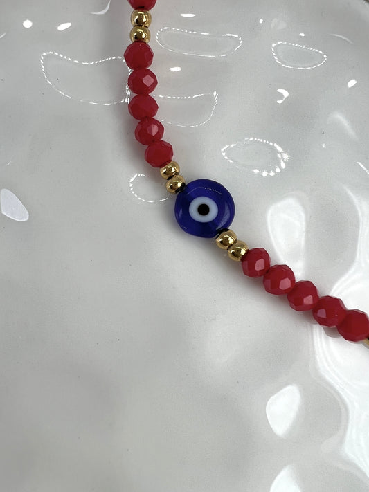 Evil eye bracelet with red and gold beads