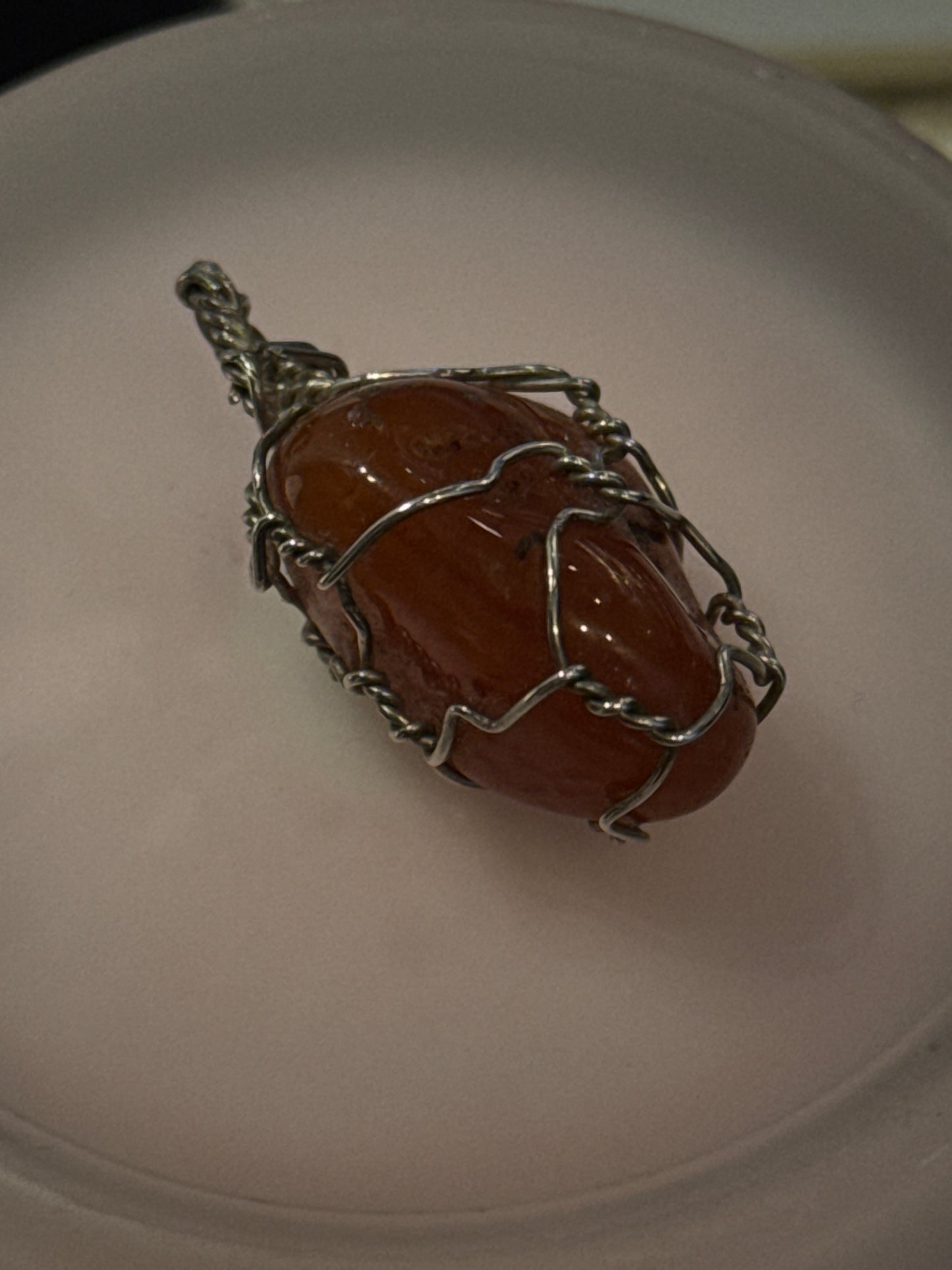 Hand wrapped carnelian pendant