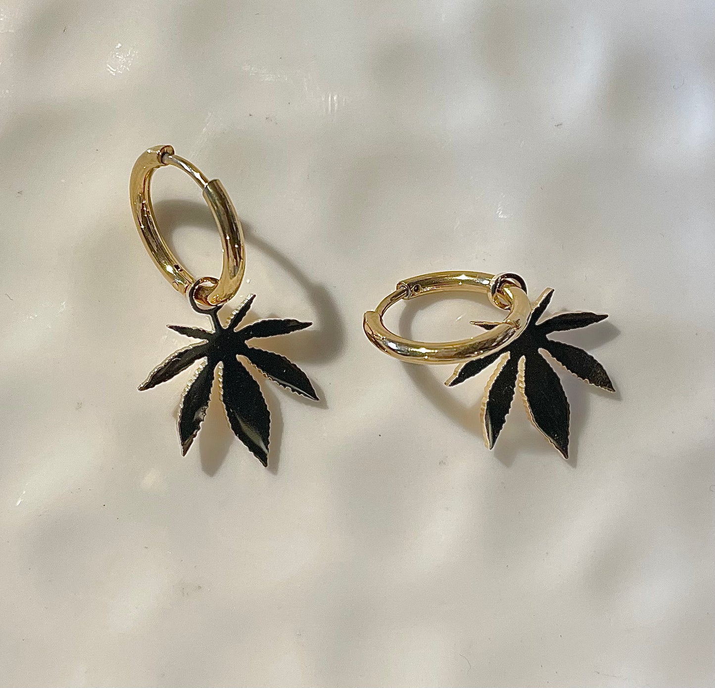 Small gold hoops with weed charm