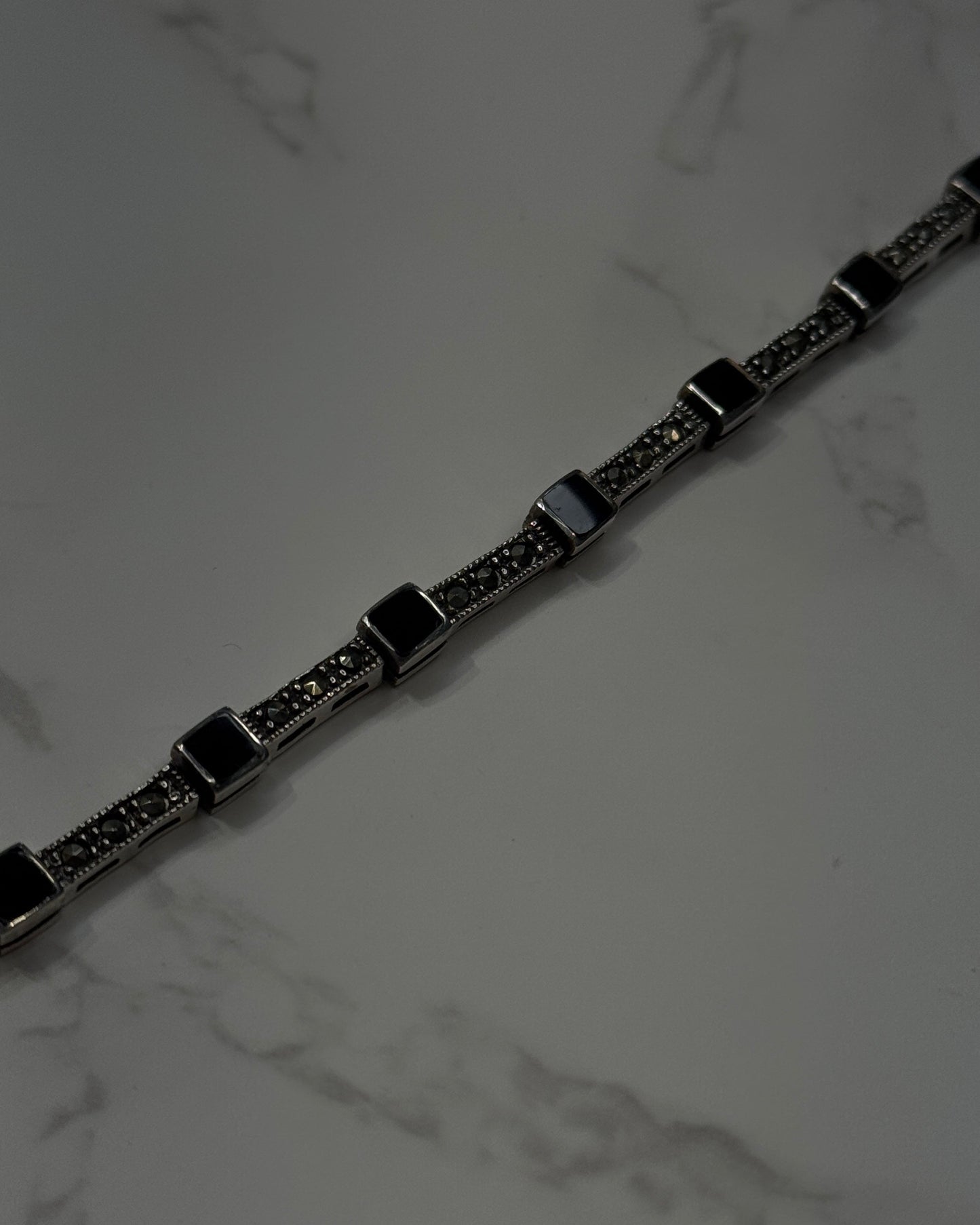 silver bracelet with onyx square shaped and cubic zirconia 
