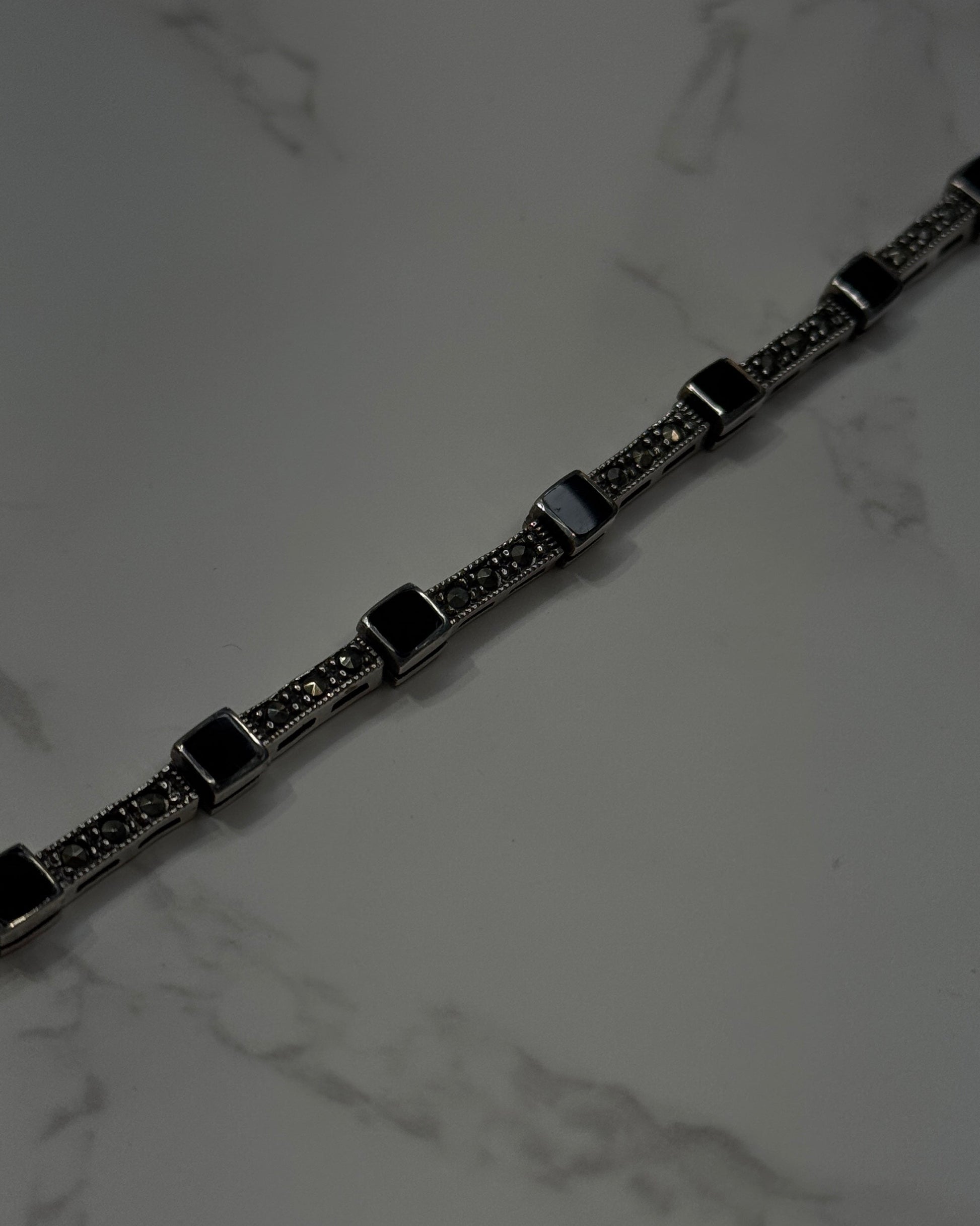 silver bracelet with onyx square shaped and cubic zirconia 